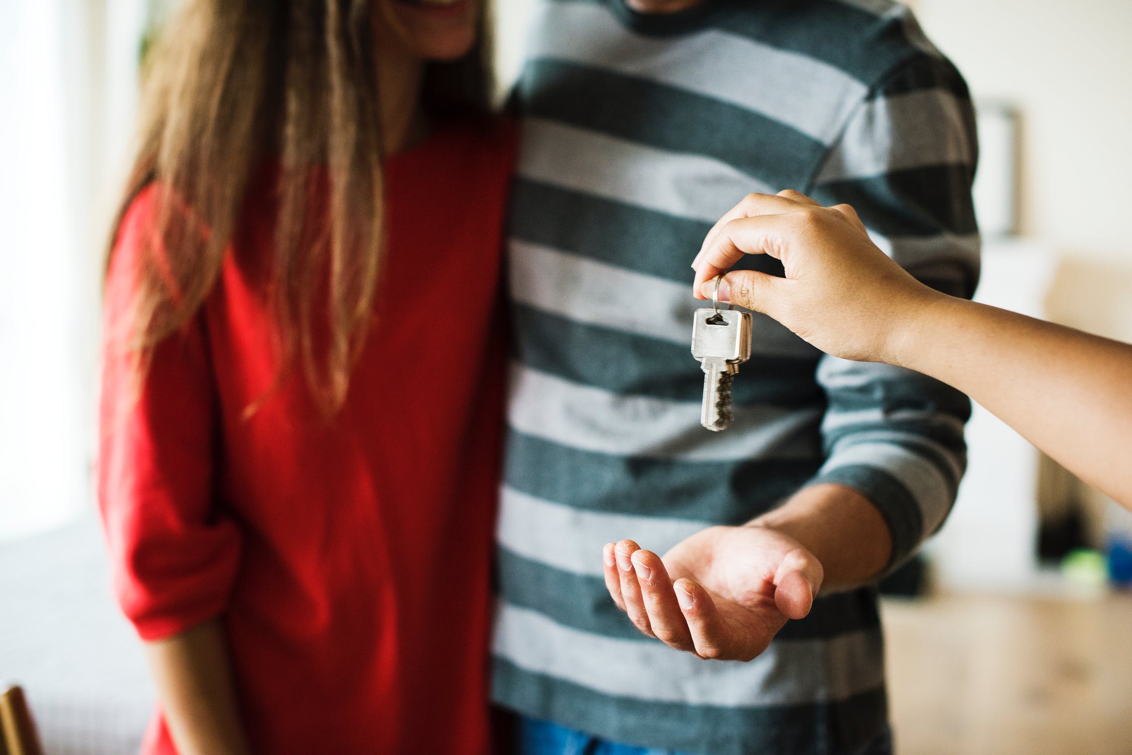 Handing over keys while closing a deal on a home